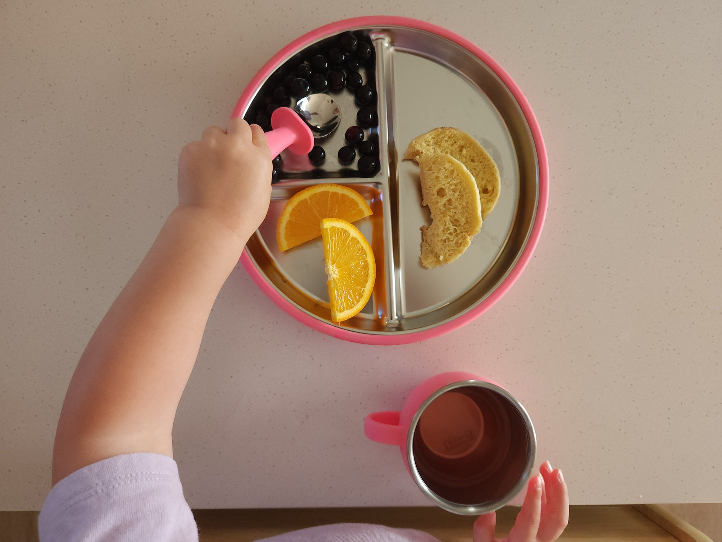 Three-section stainless steel toddler plate with pink silicone suction sleeve, food-grade, non-slip mess free