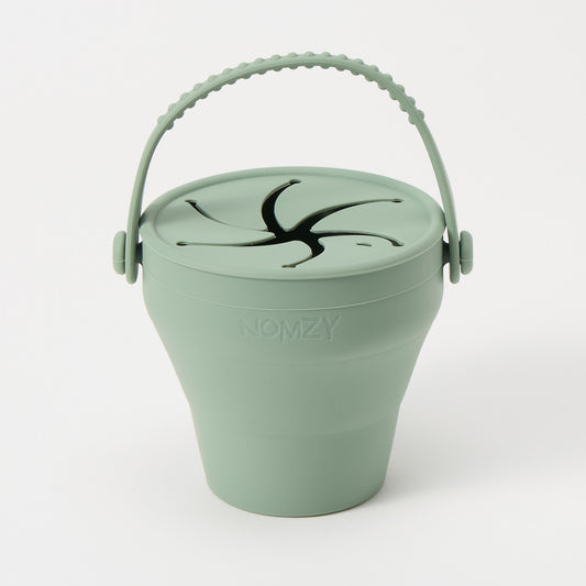 Nomzy silicone snack cup fully expanded with soft petal opening