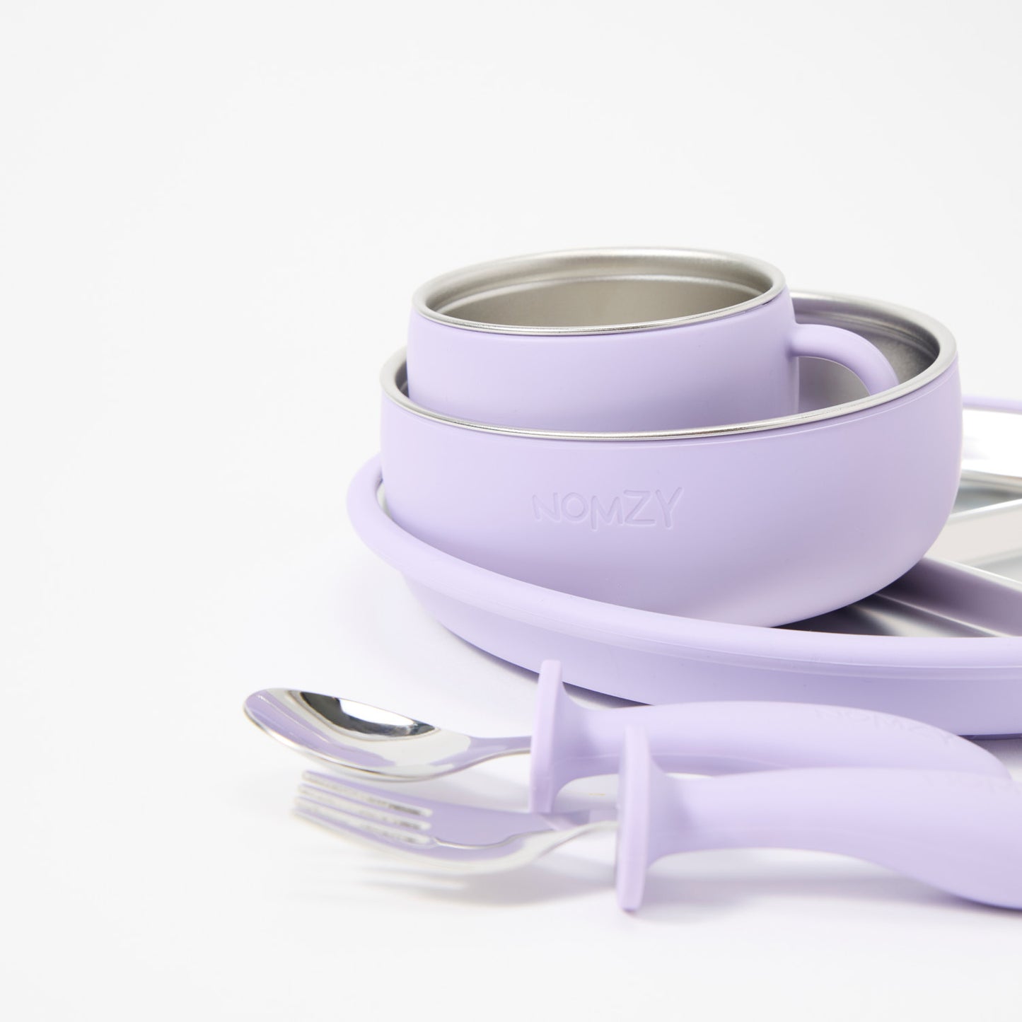 Nomzy stainless steel toddler dinnerware set with plate, bowl, cup, spoon and fork lilac close up 